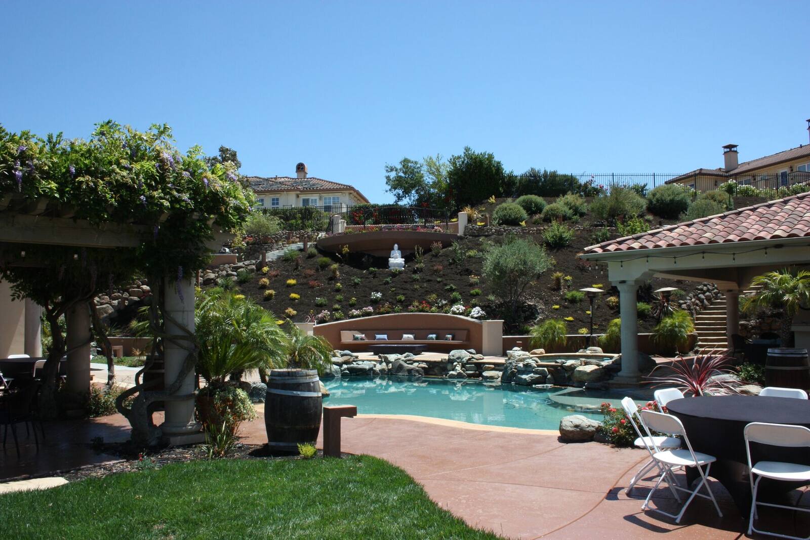 The pool and lower gathering terrace viewed from the garden.