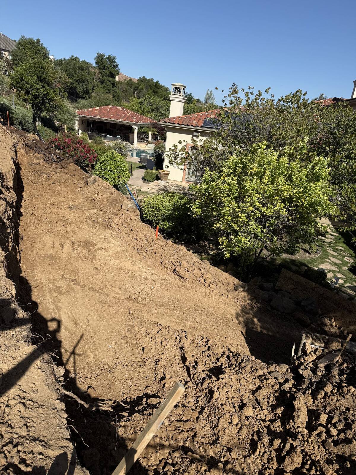 The hillside being cut and graded for the new ascent.